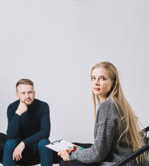 portrait-female-psychologist-sitting-front-patient-therapy-session
