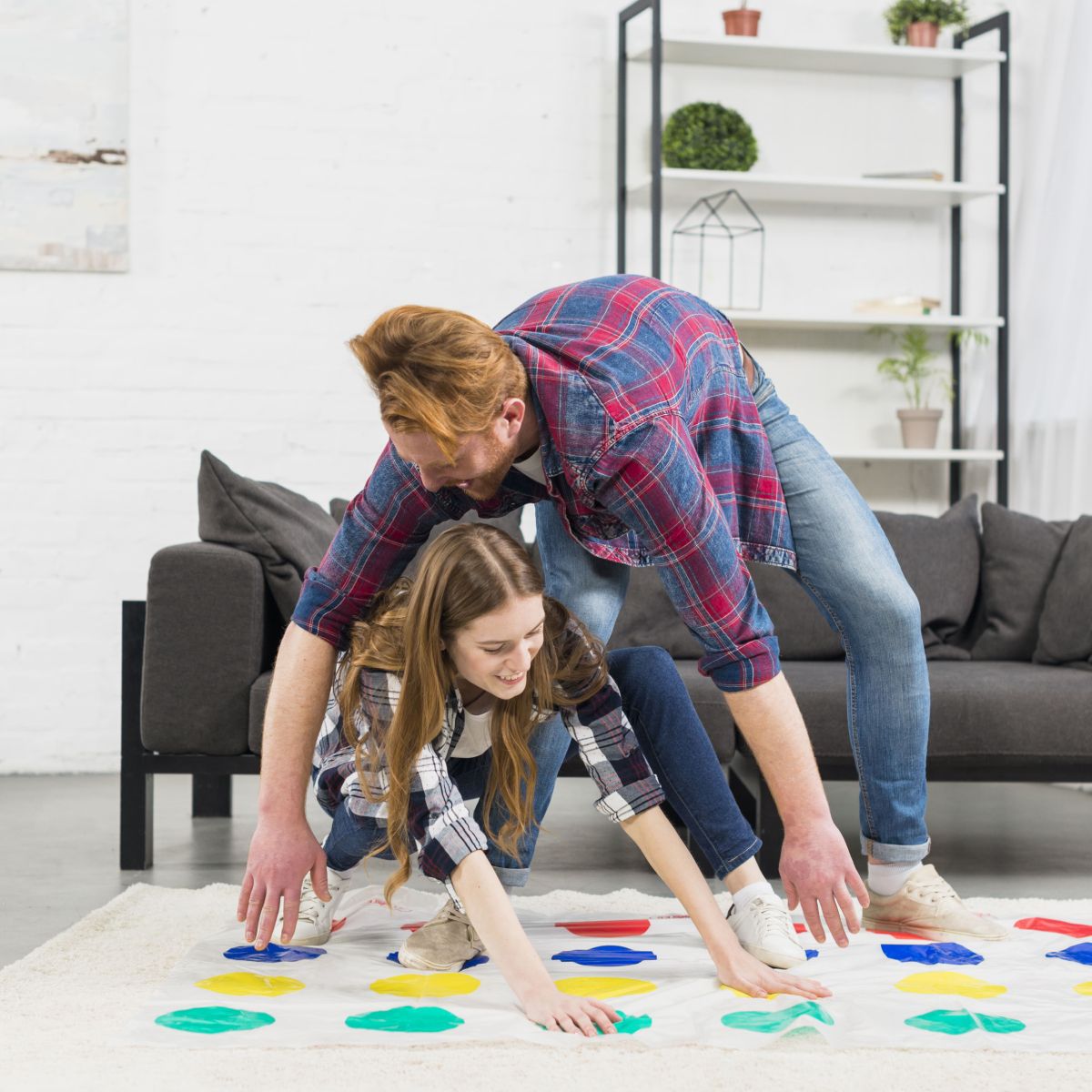 young-couple-trying-take-position-dot-game-home Young Couple Trying Take Position Dot Game Home